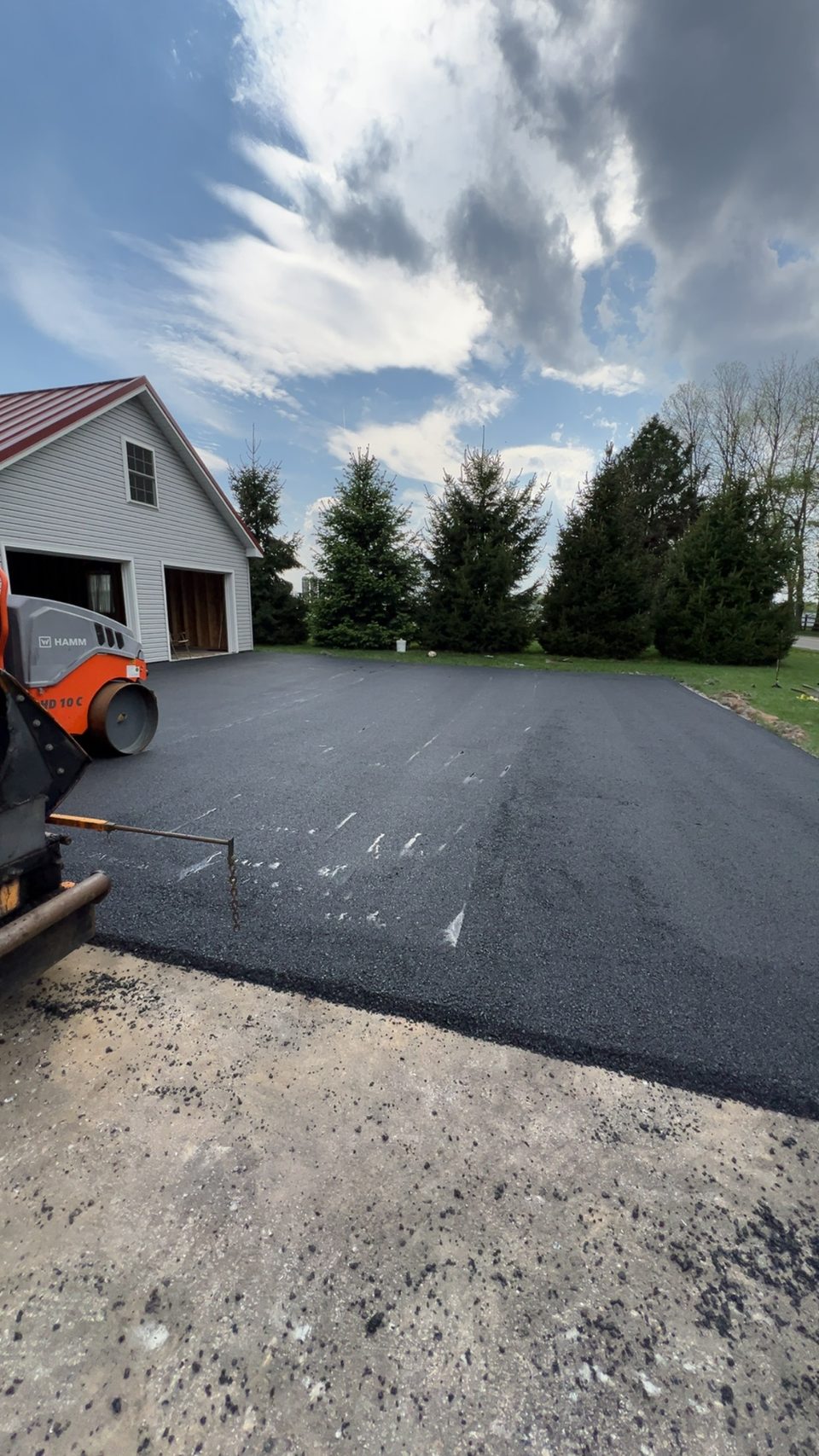 Paver laying a smooth mat of hot-mix asphalt