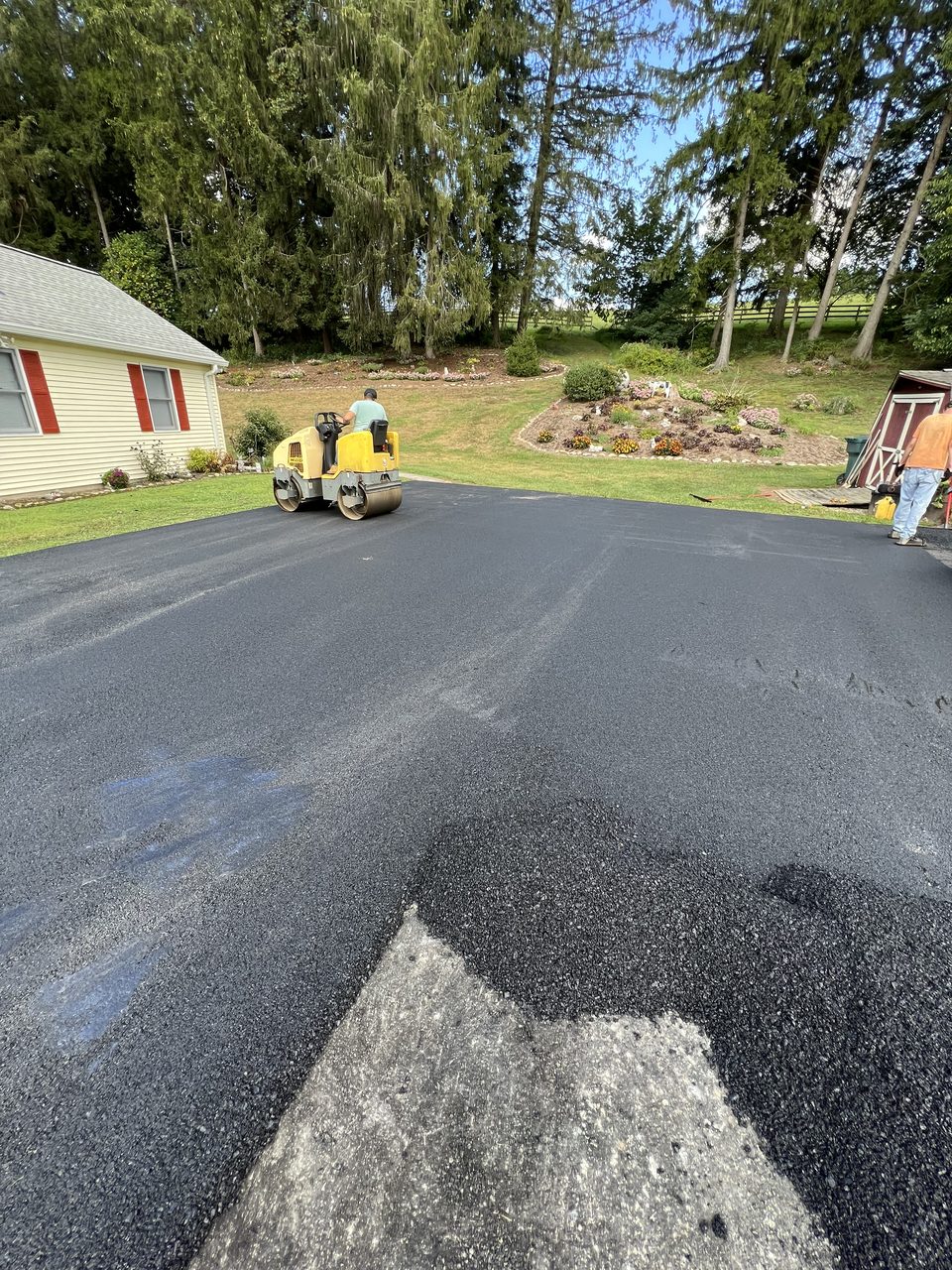 Long rural driveway paved in New Hampshire